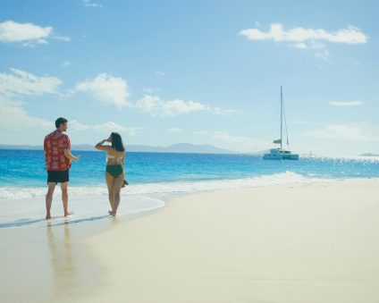 best bvi yacht charter, couple walking on the beach