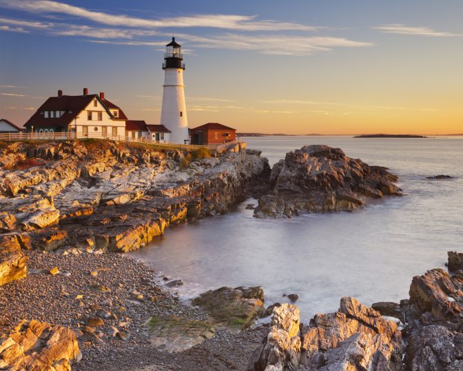 America lighthouse bay at sunset