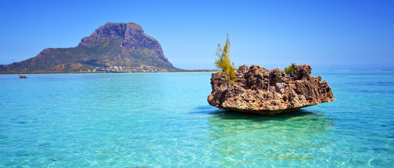 Indian Ocean pristine waters rocks and yacht