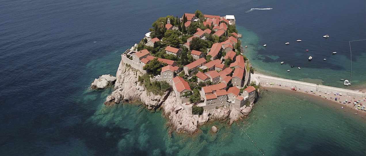 Montenegro island cliff red houses landscape