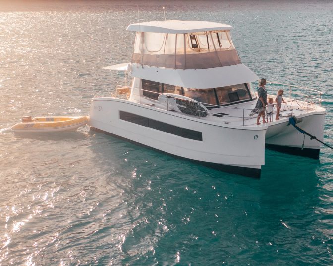 Power catamaran at sunset